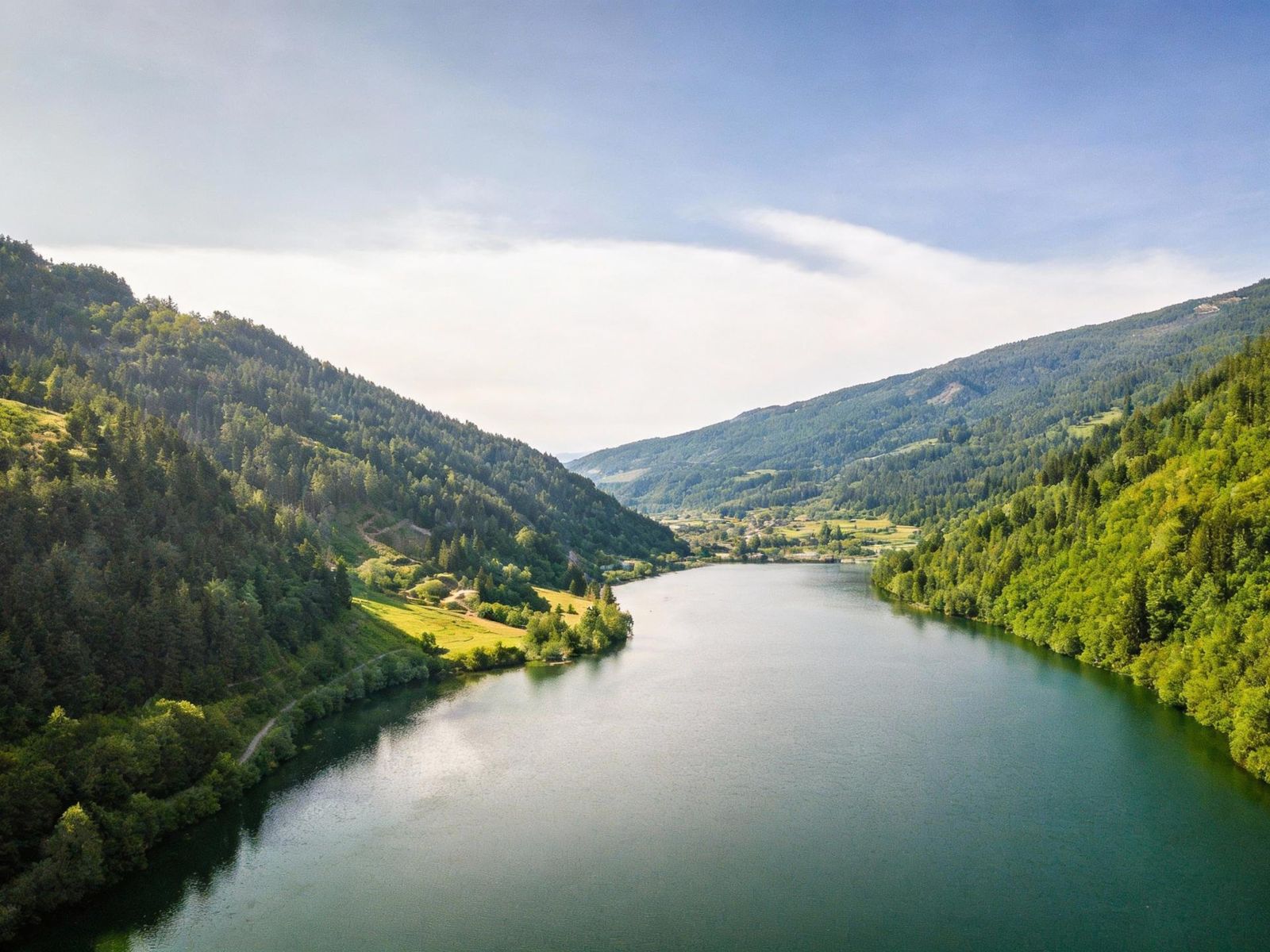 Aerial view along the Afritzer See between steep forested hills